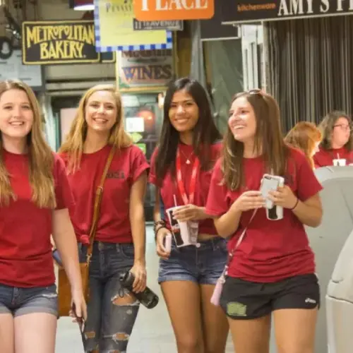 Students wearing red Class of 2021 t-shirts inside Reading Terminal Market