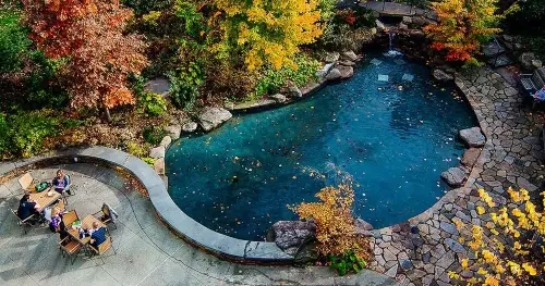 Aerial view of students at seating area outside Easton Cafe in the fall.