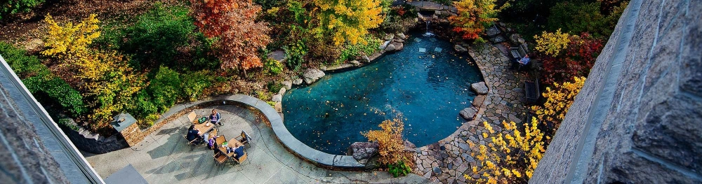 Aerial view of students at seating area outside Easton Cafe in the fall.