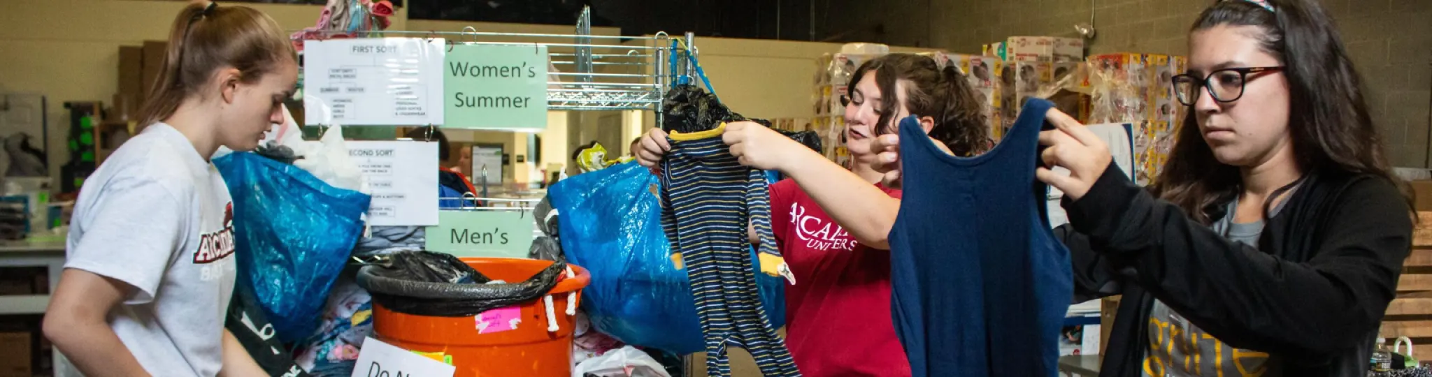 Students at Day of Service organizing clothes