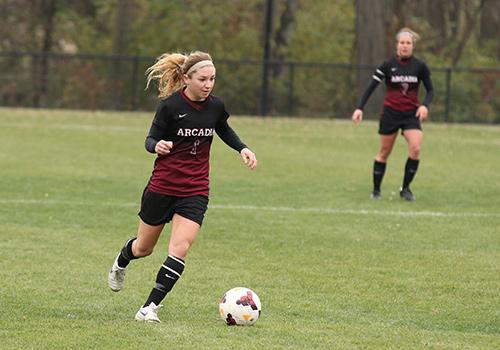 Women soccer players on the field.