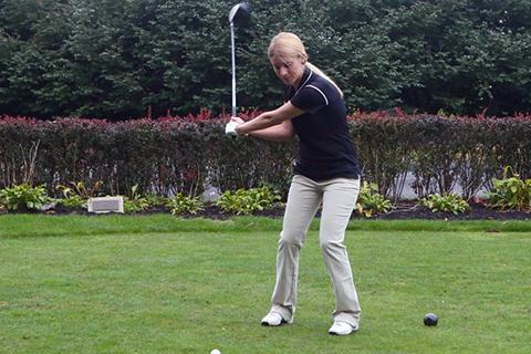 A golfer swinging