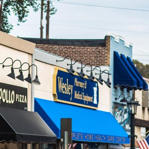 A photo of downtown Glenside that includes Leather Case, Apollo Pizza, Main Line Baskets, and Wesley Pharmacy