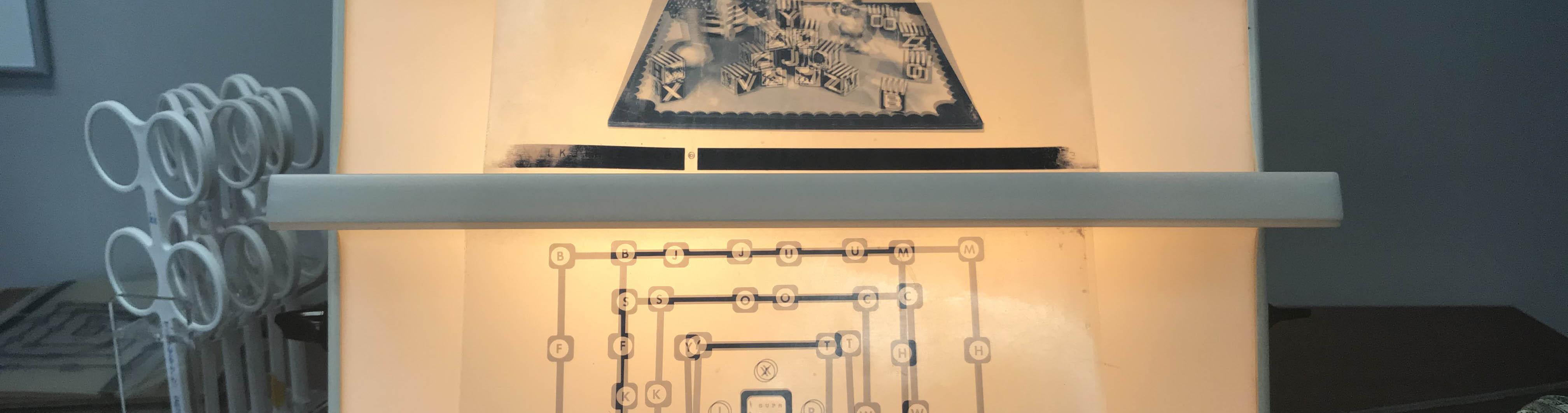 exhibit displaying connecting squares with numbers and letters