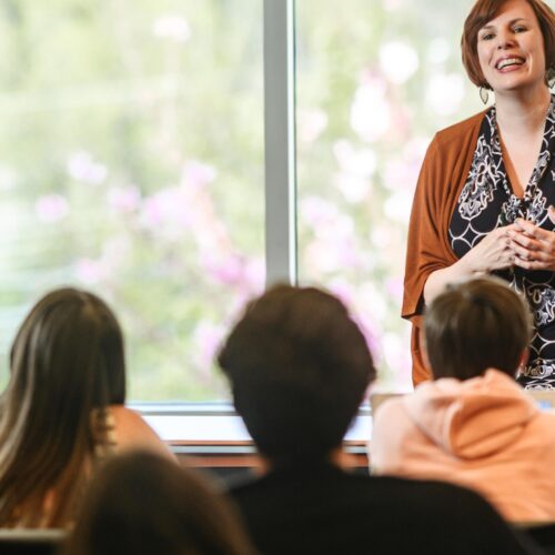 A woman speaking to a group.