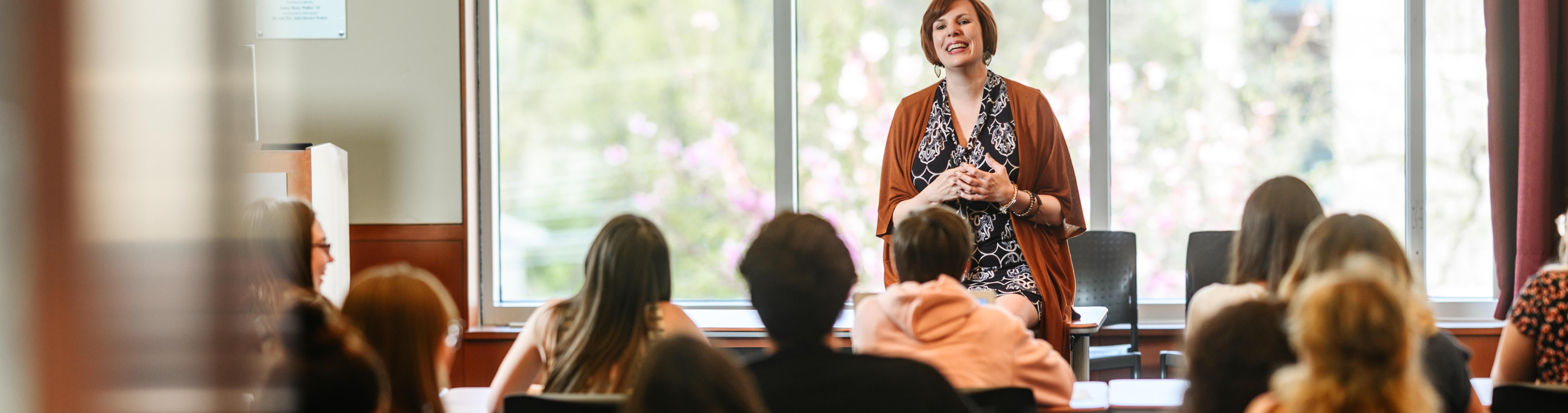 A woman speaking to a group.