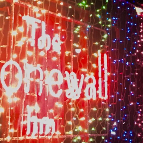 Picture of lights with the florescent sign The Stonewall Inn.