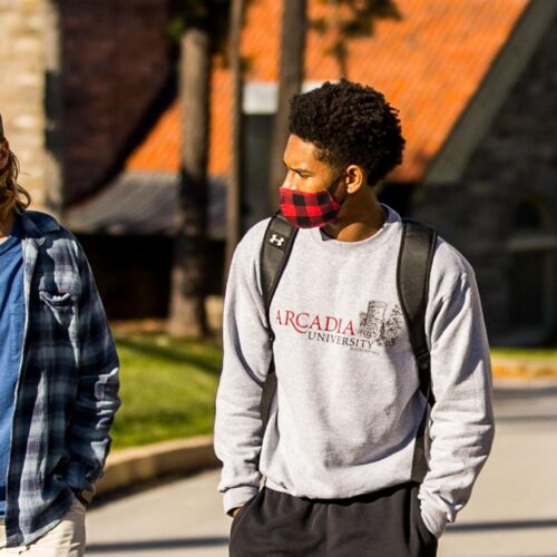 Four students walking together on Arcadia Campus.