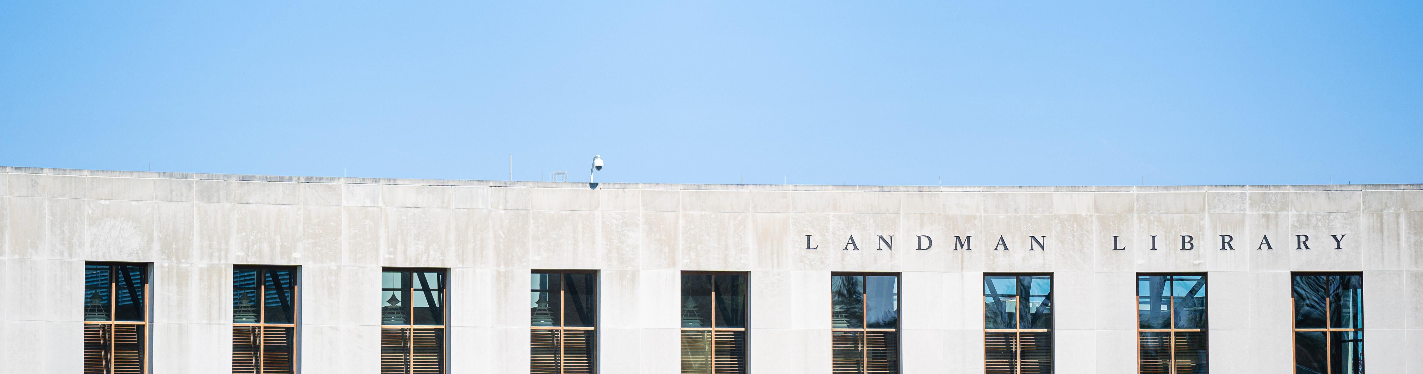 Front view of Landman Library building with windows and title