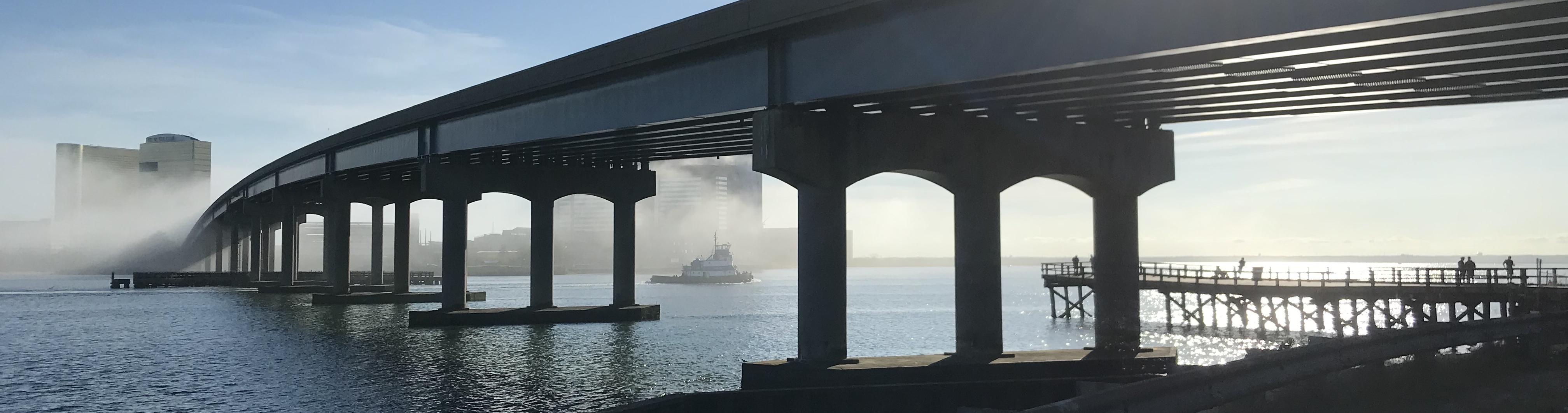 wide shot of a bridge above a body of water