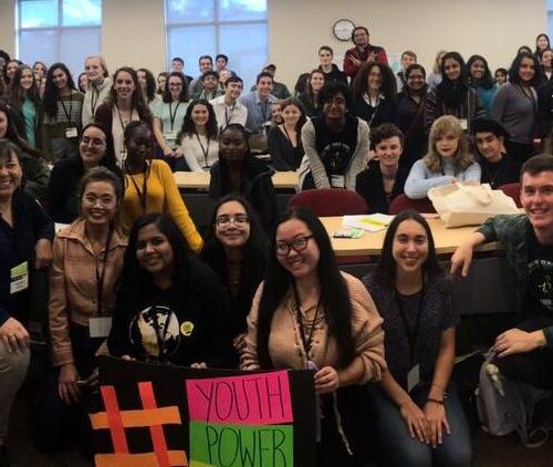 A large group of students gathered in a classroom