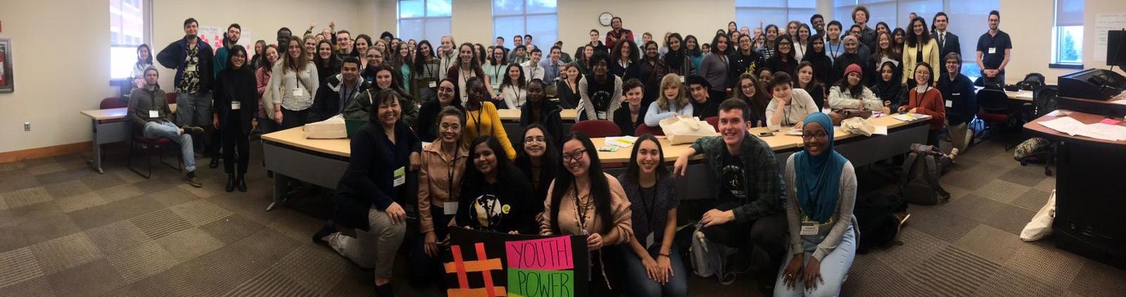 A large group of students gathered in a classroom