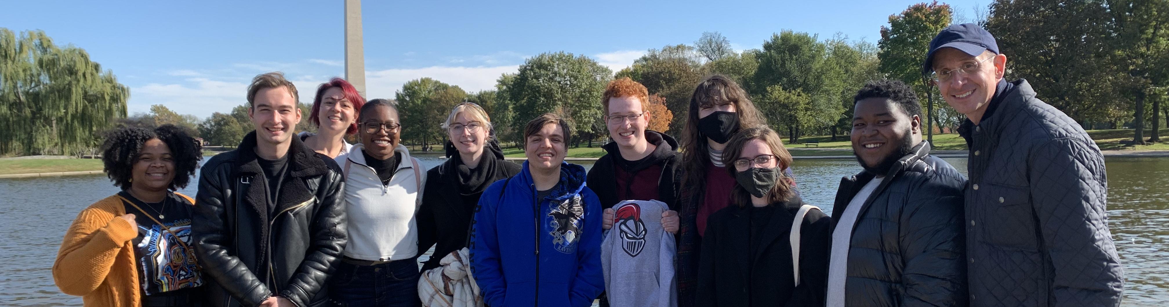 A group visiting DC with the Washington Monument in the background