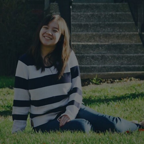 A banner of different student portrait photos with large student photo in the middle