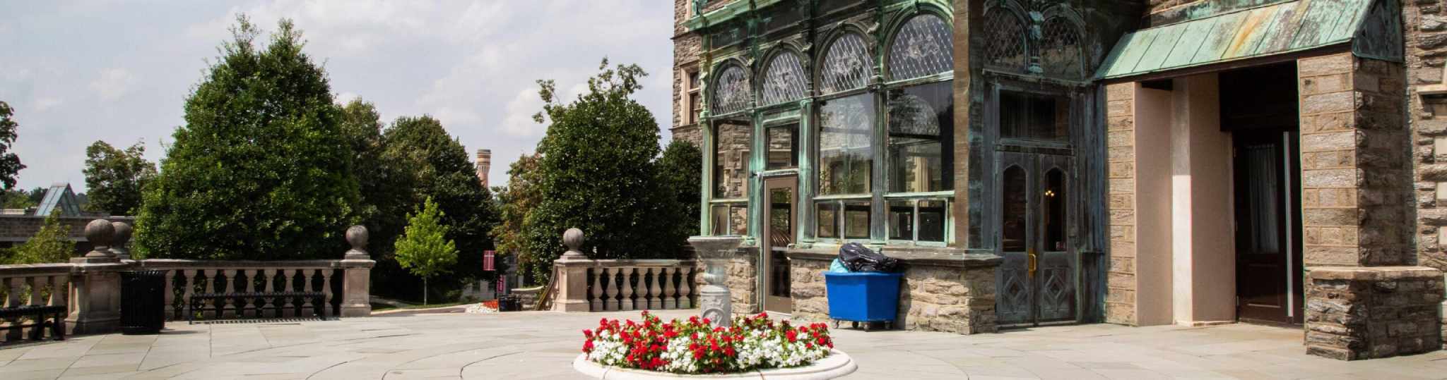 Side entrance of Grey Towers Castle with flowers in the center