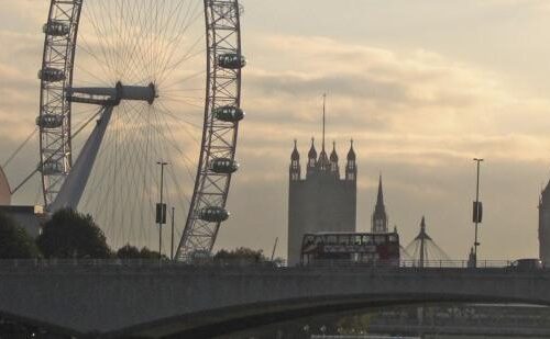 Silhouettes of London's Big Ben Tower and The London Eye ferris wheel