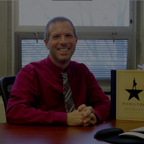 A collage of many headshots, centered is Dr. Matt Heitzman.