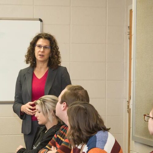 Dr. Slesaransky-Poe speaks to a group of students.