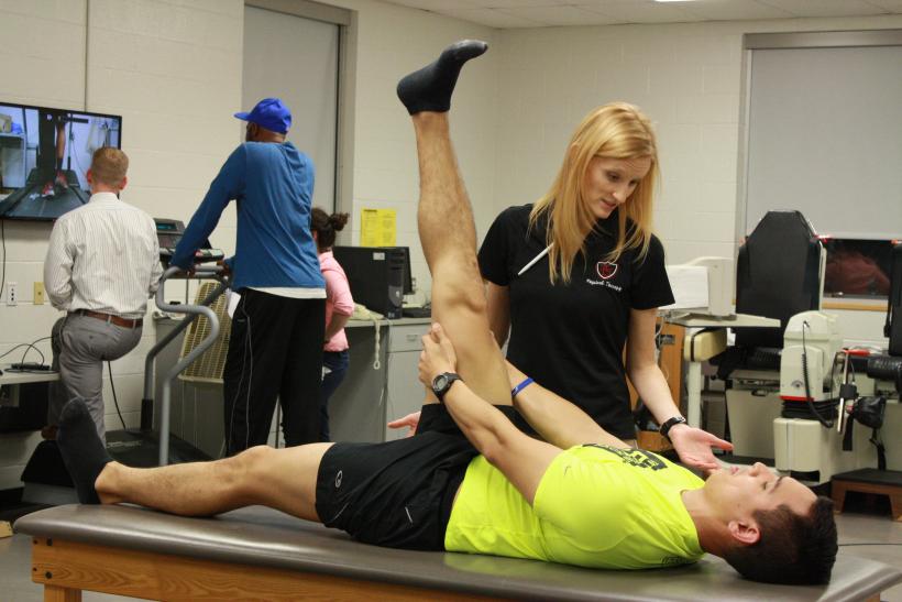 PT students participating physical therapy sessions related to running injuries.