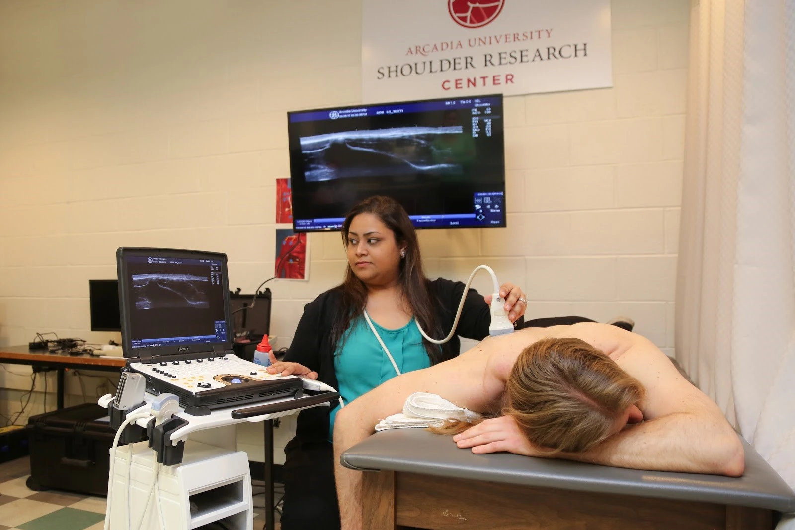 Kshamata Shah does research in a clinical- and laboratory-based study for a patient with a shoulder disorder.