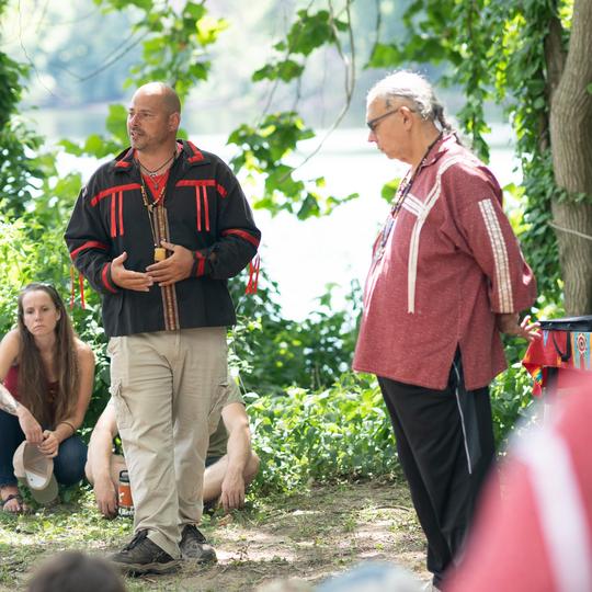 A speaker make acknowledgment of Lenape people outside