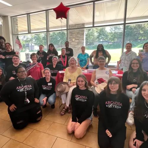 Students and staff at a tabling event in the Commons to register other Arcadia students to vote.