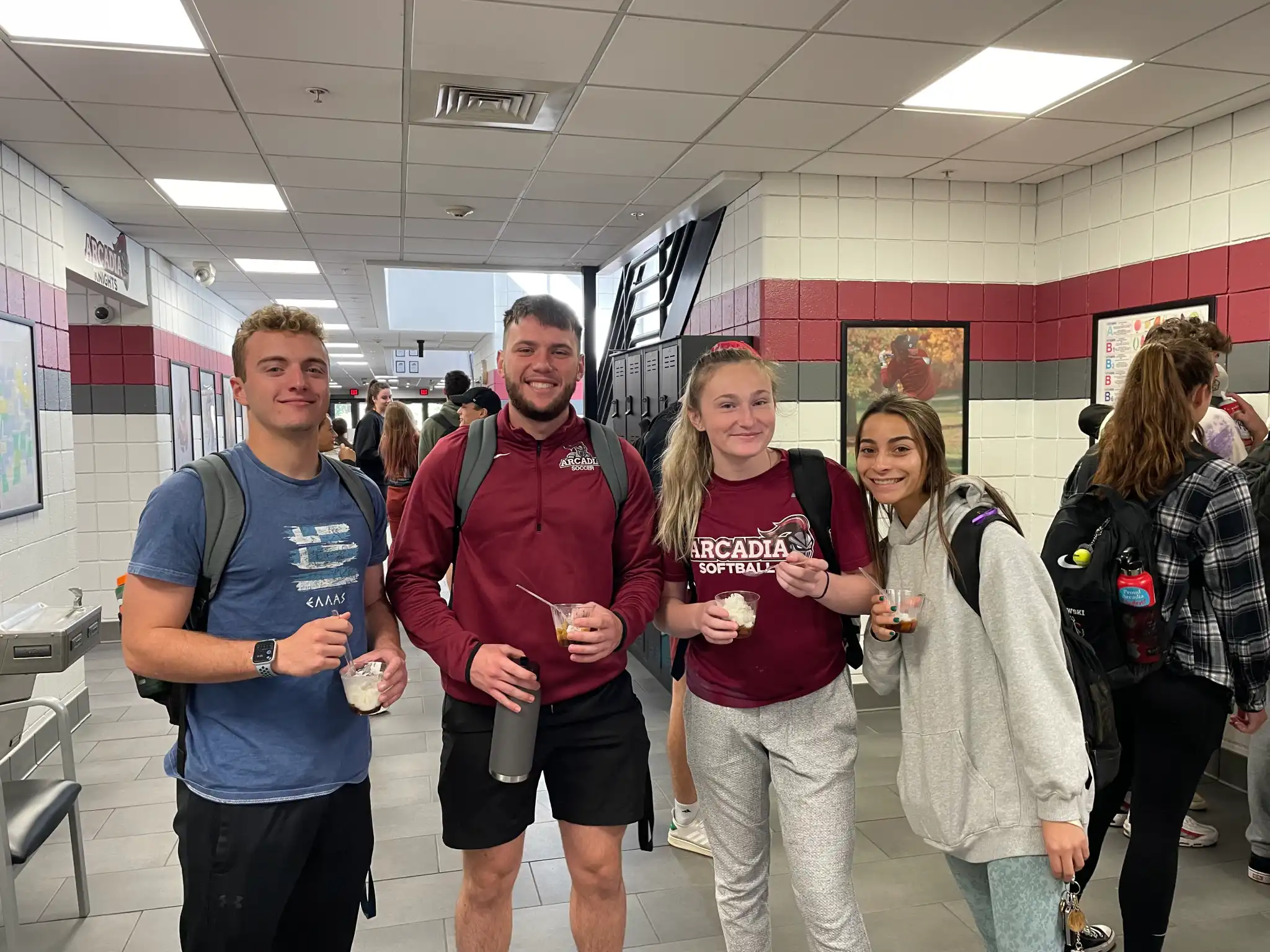 Students smiling and posing to the camera in the Kuch Center