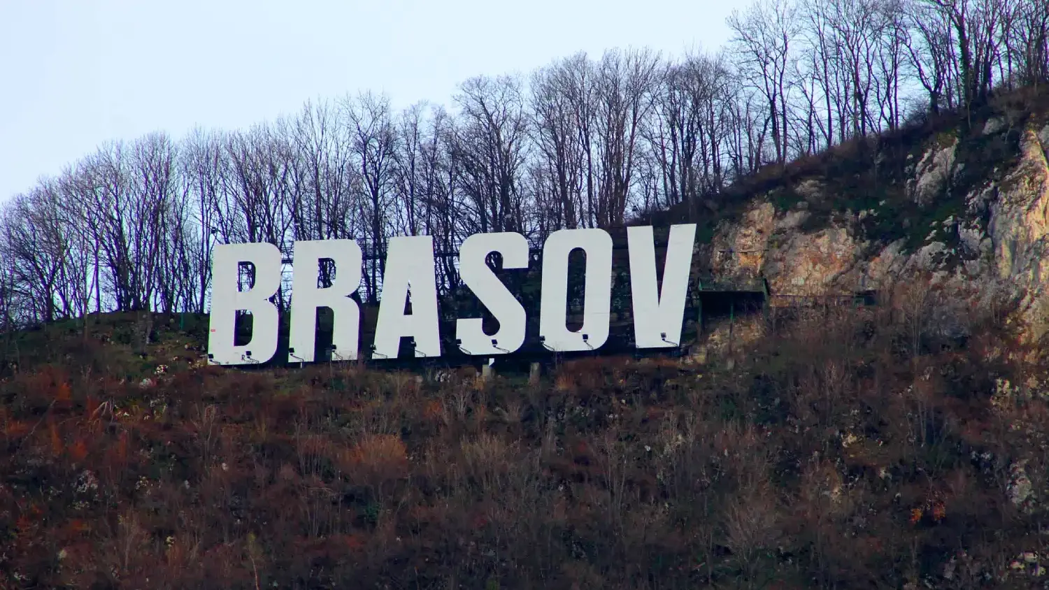 a photo of a large sign set into a hill that reads 