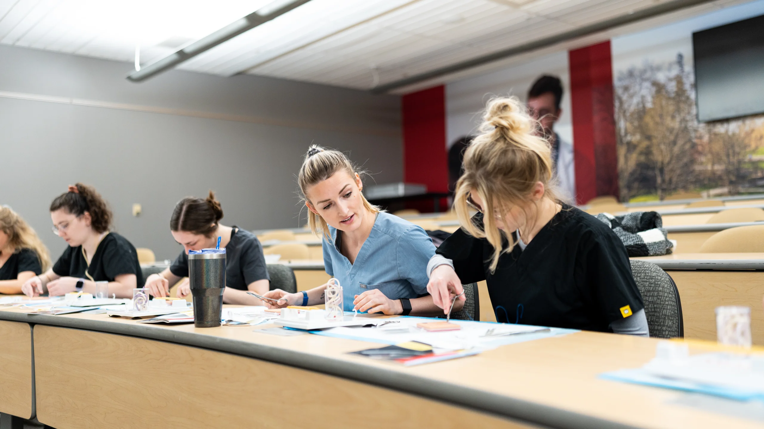 Physician Assistant students work in a classroom.