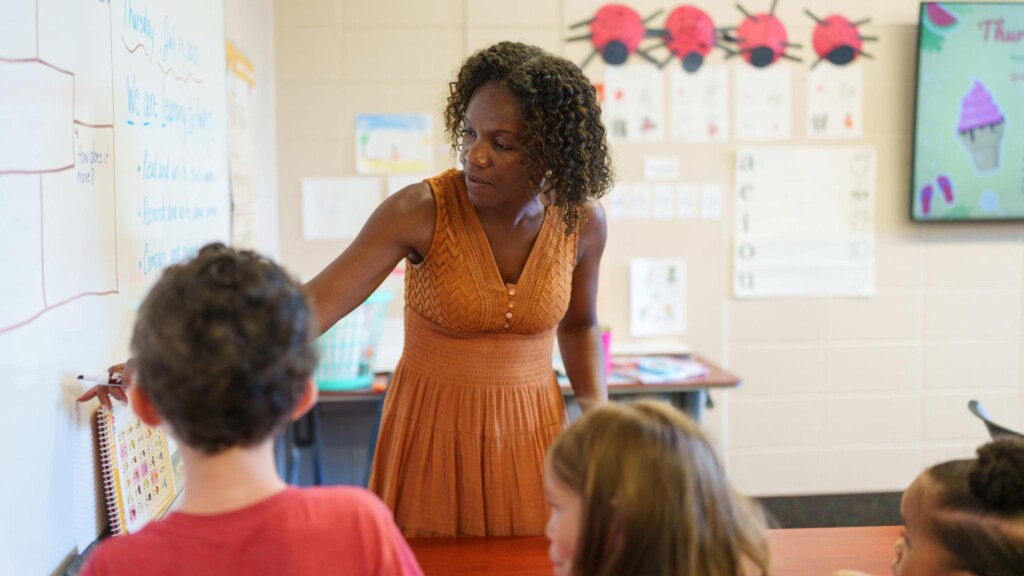 An education grad student teaches children to read