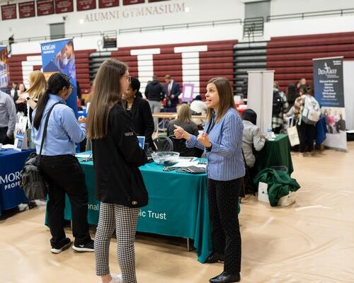 Students speak with potential employers at the 2023 Internship and Career Fair