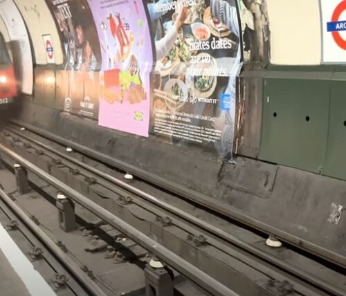 A photo a train arriving at their station in a subway