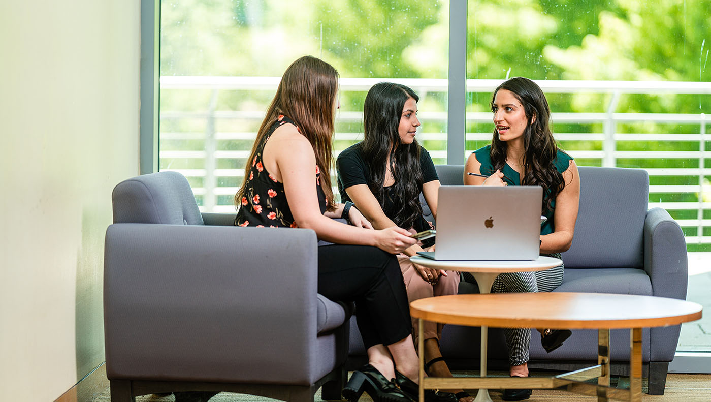 Two Arcadia students involved in discussion on the campus in the Fall.