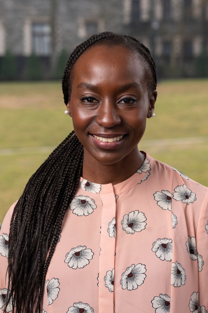 headshot of Anna Cheluget in front of Arcadia University castle