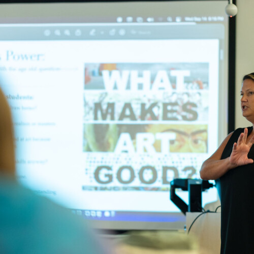 Professor instructs graduate education class in art education.