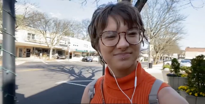 Danita smiling and walking through the Keswick Village.