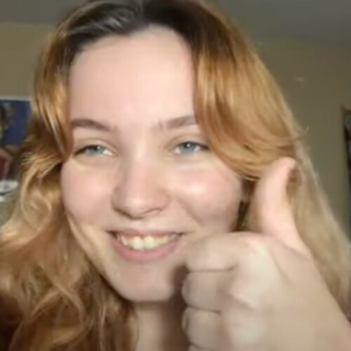 A photo of Zara giving a thumbs up.