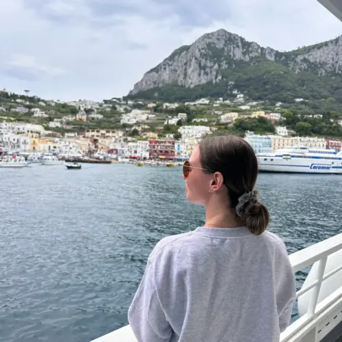 Katelyn standing looking out at some water.