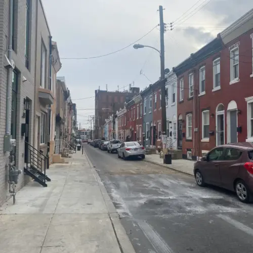 A photo of a street in Kensington with buildings on both sides.