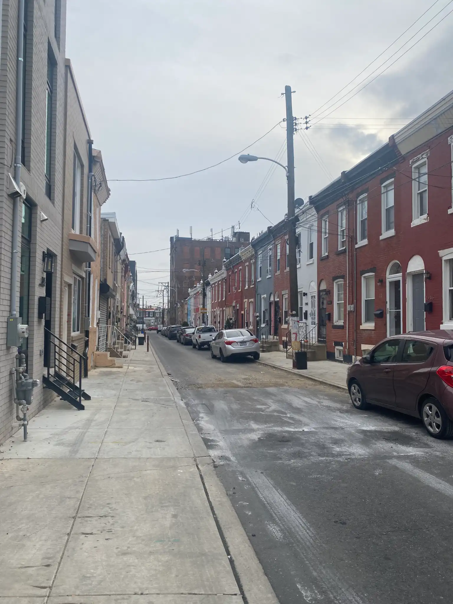 A photo of a street in Kensington with buildings on both sides.