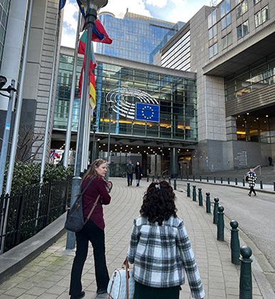 Flags wave around the entrance to the UN in Belgium.