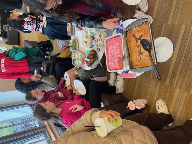 Students eating baked treats for a cause.