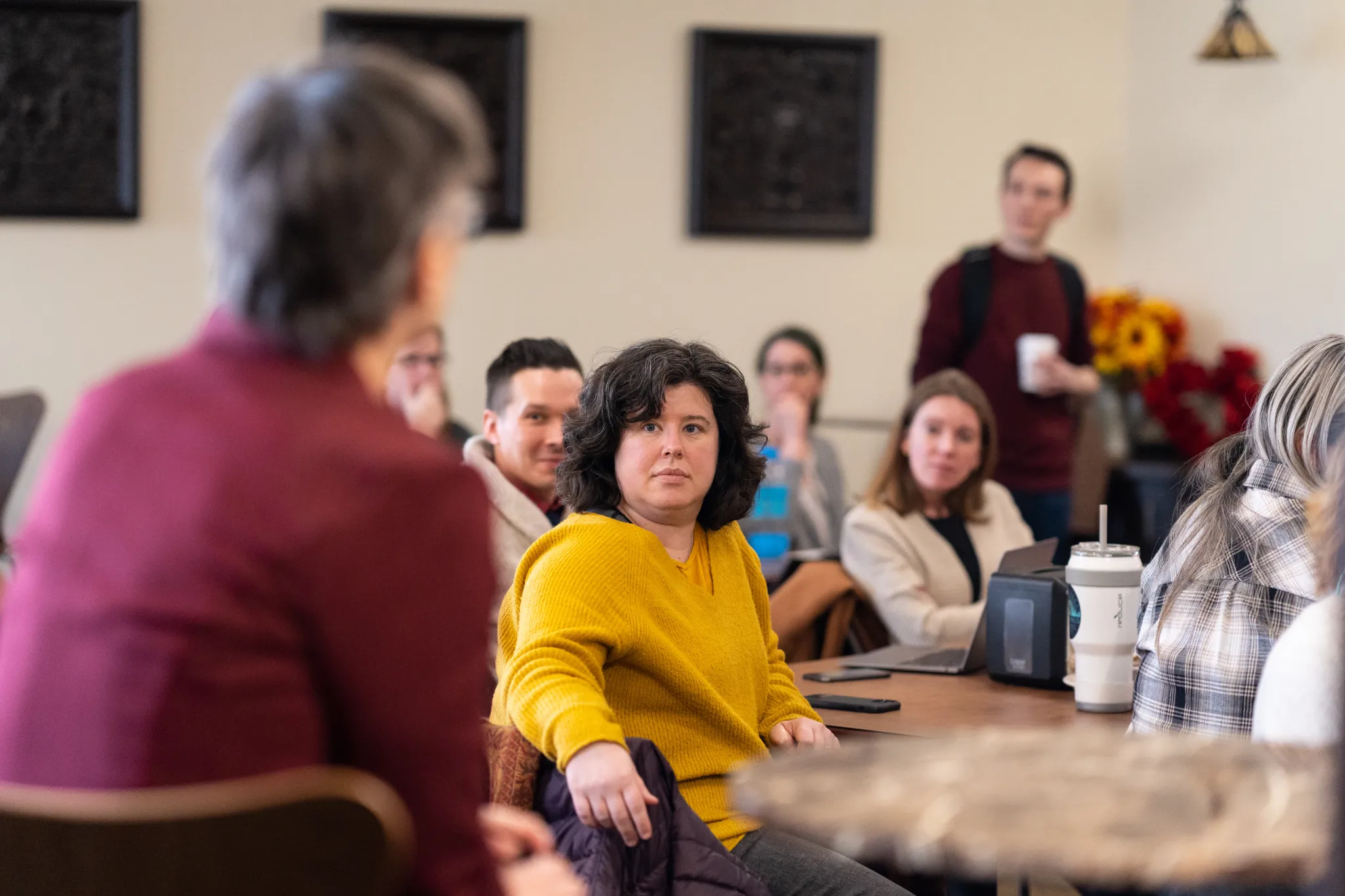 Faculty members meet for a lunch and learn event on campus.