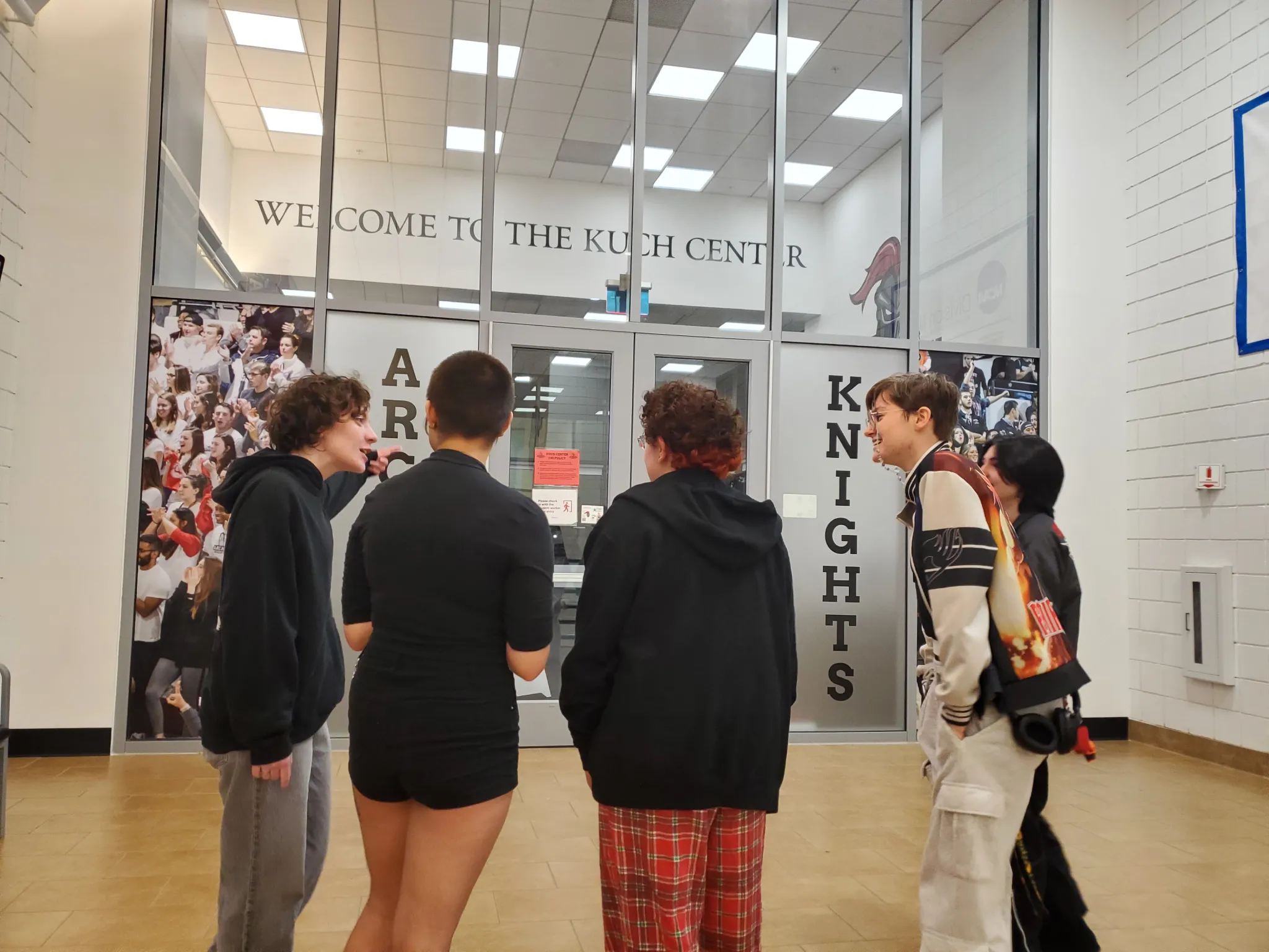 Students preparing to enter the Kuch Center.