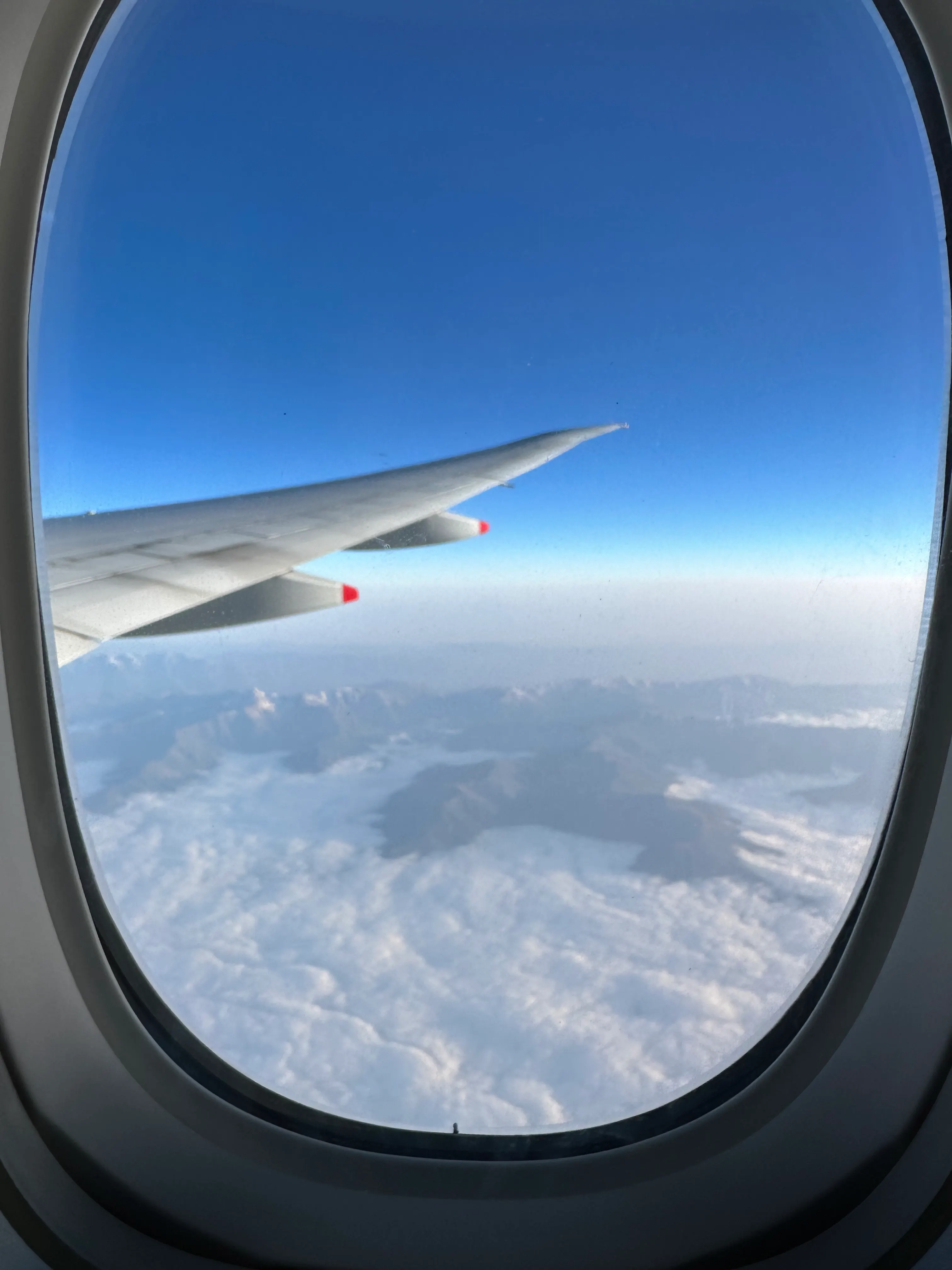 A photo taken out the window of a plane.