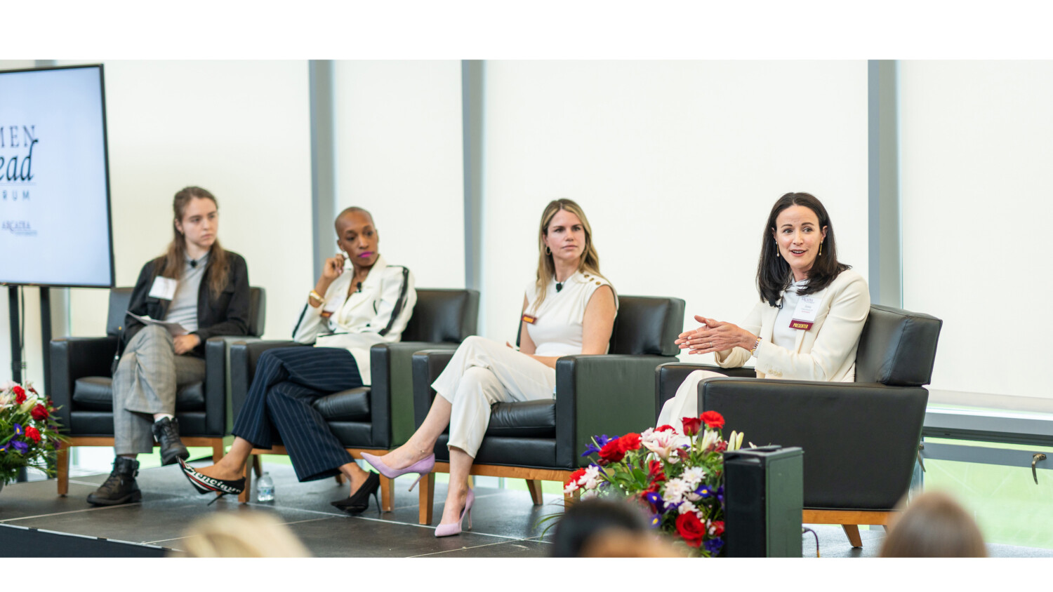 Four speakers sit on stage during the Women Who Lead Forum 2024 at Arcadia University.