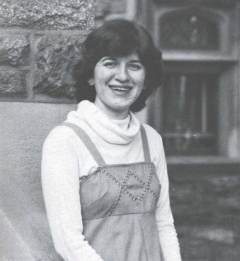 A black and white photo of a woman outside Grey Towers