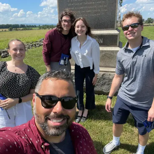 Dr. Favian Martín with four Criminal Justice majors at the NEACJS conference.