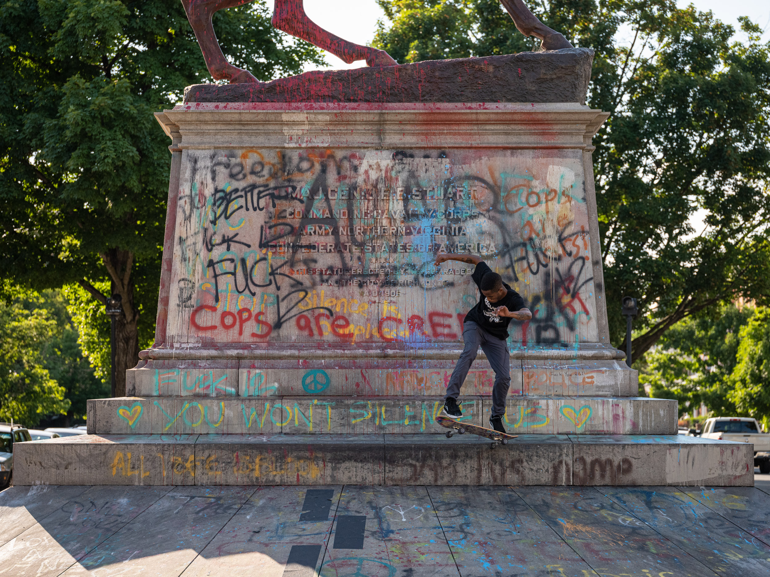 A skateboarder practices on the plinth of the J.E.B. Stuart statue on Monument Ave.