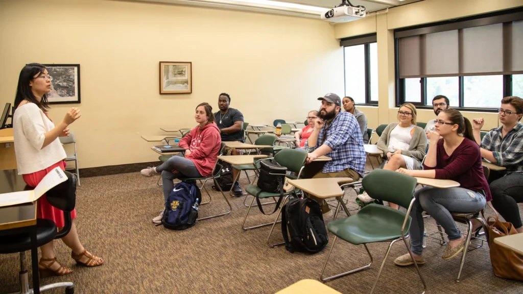 Dr. Cathy Lee teaches a class of counseling students.